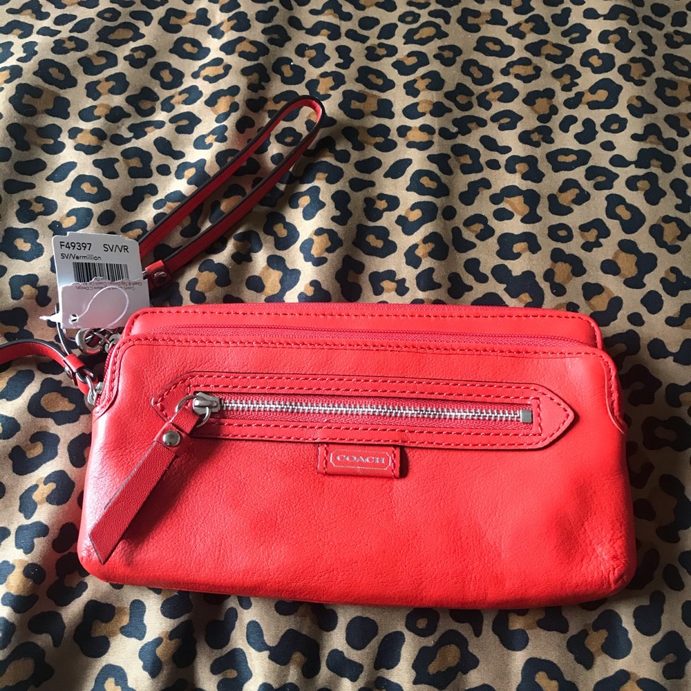 NWT Coach double zipper orange leather wristlet